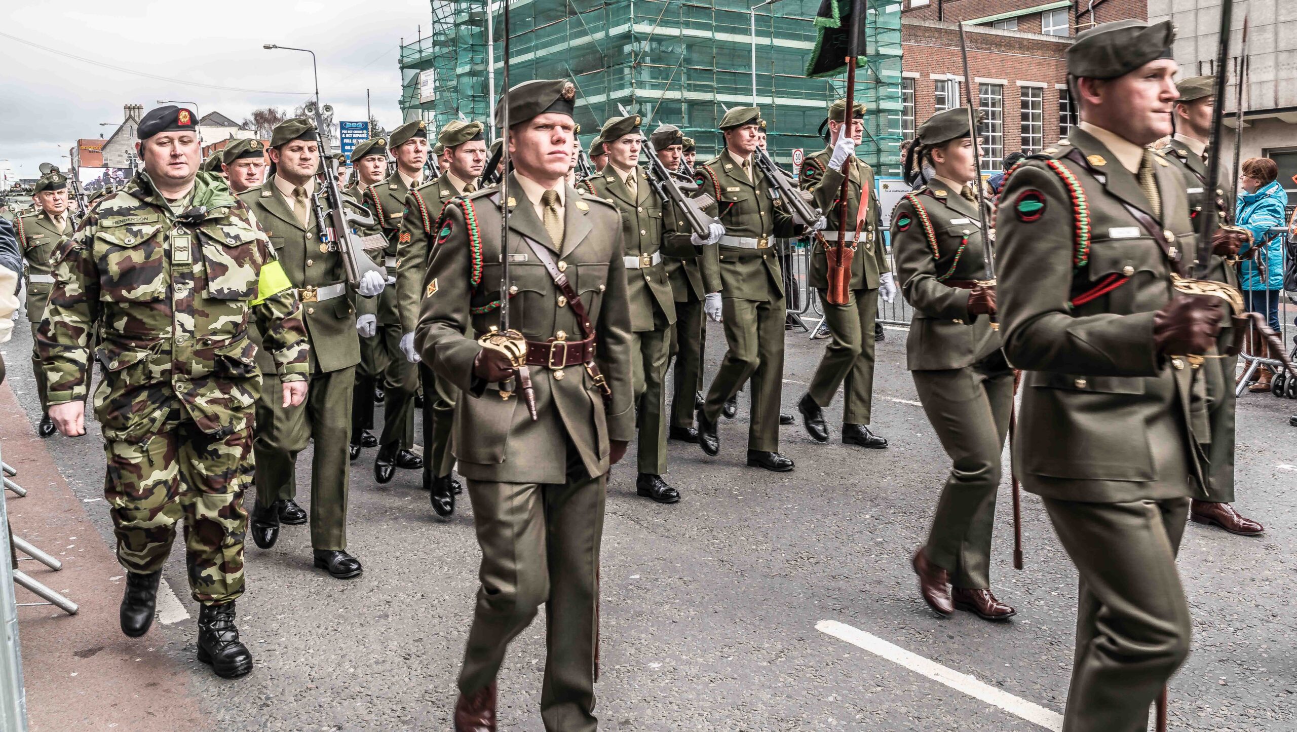 Military walking on the road.